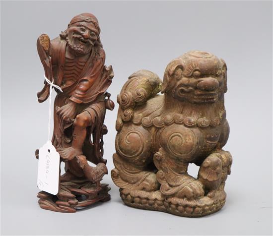 Two Chinese wood figures of a lion and a luohan tallest 21cm